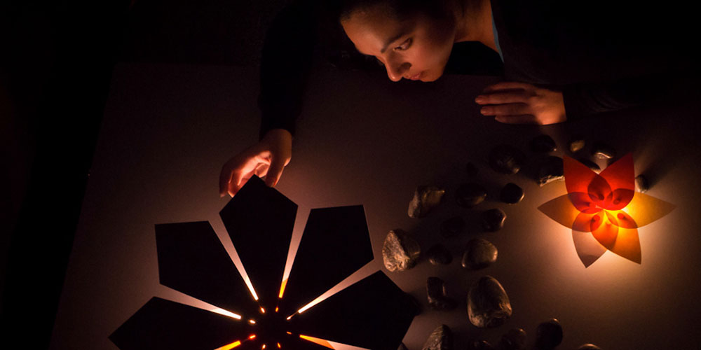 A student perfects a lighting display