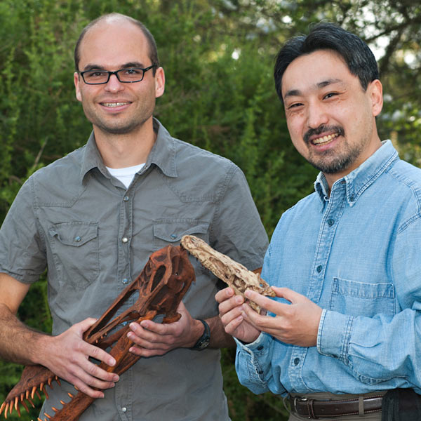 Two UC Davis professors hold dinosaur fossils