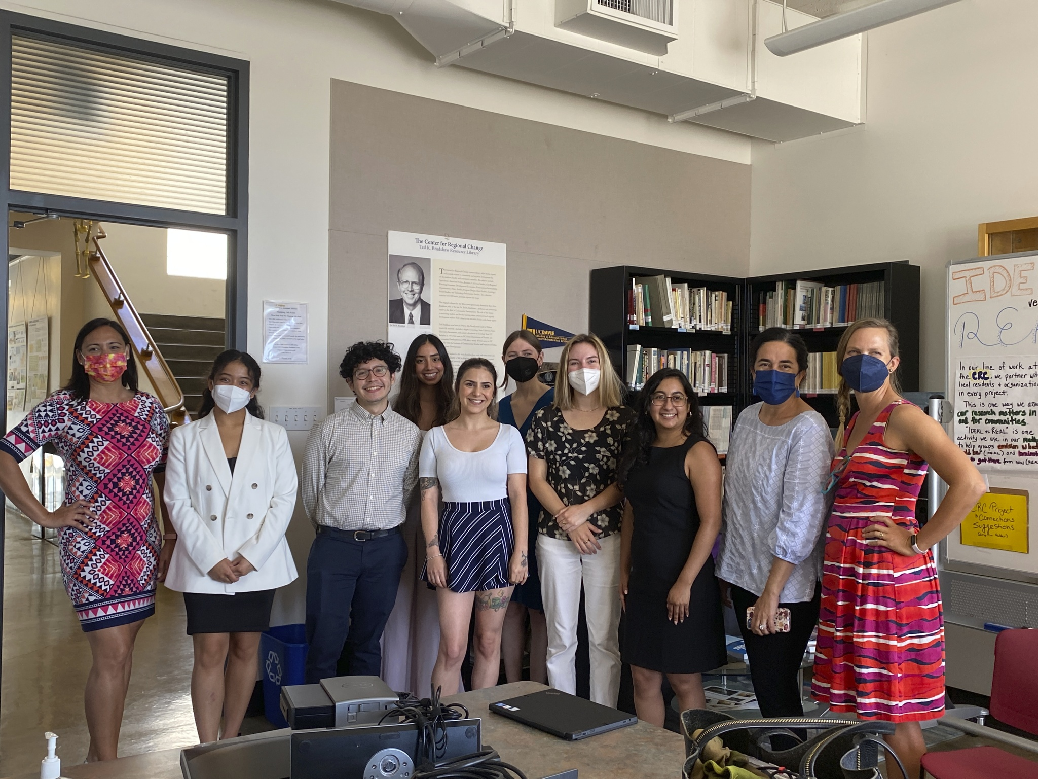 A group of students pose together in a classroom at UC Davis.