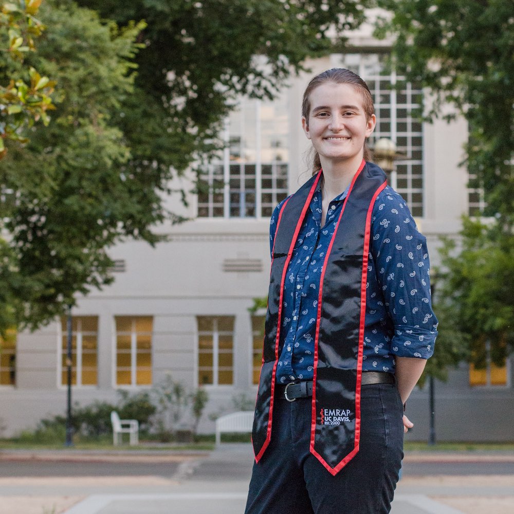 Anna stands in front of Shields Library at UC Davis. 