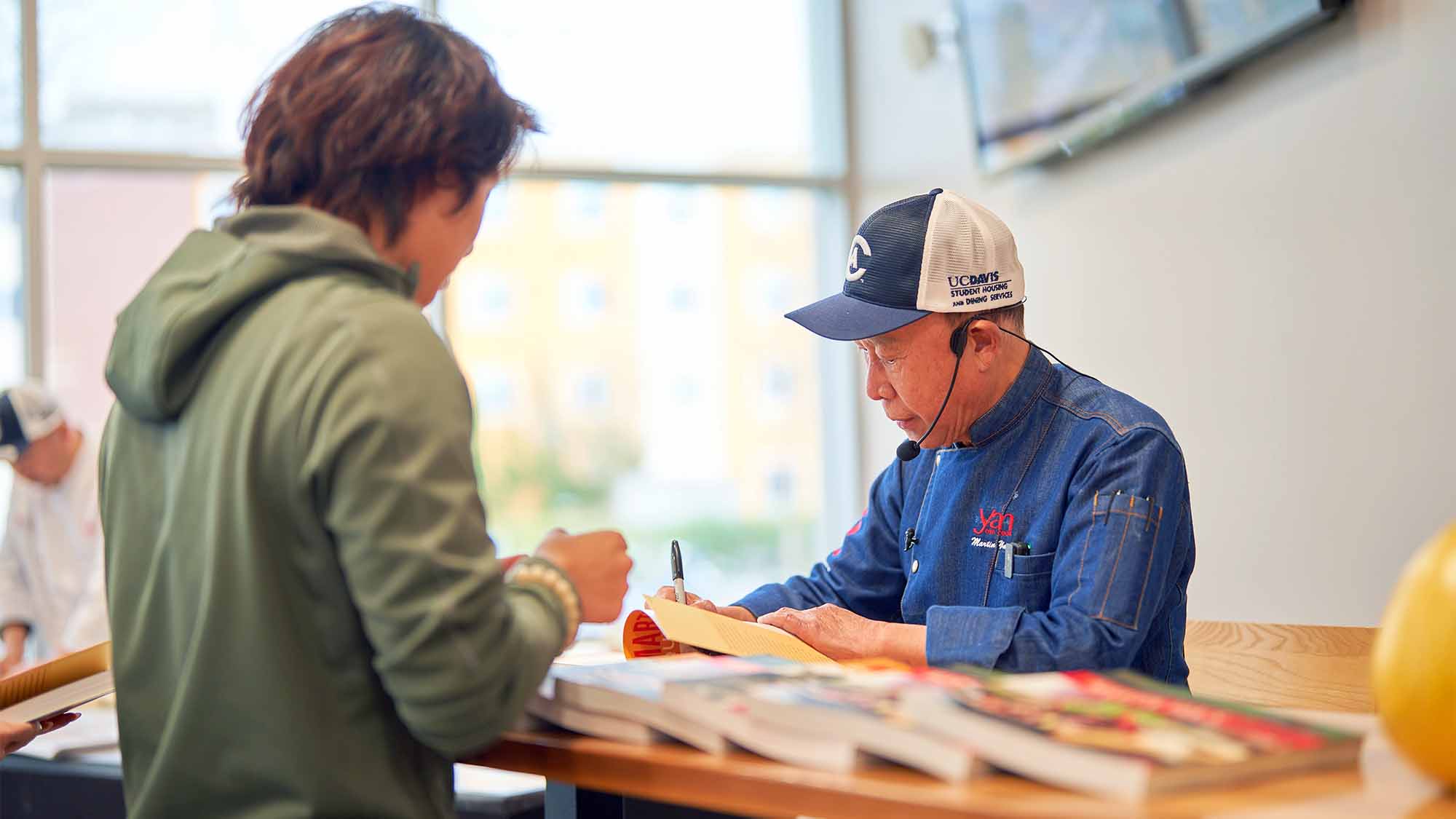 Martin Yan signs an autograph