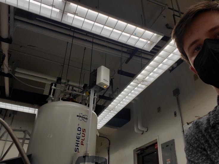 Nathan wears a mask inside a lab.