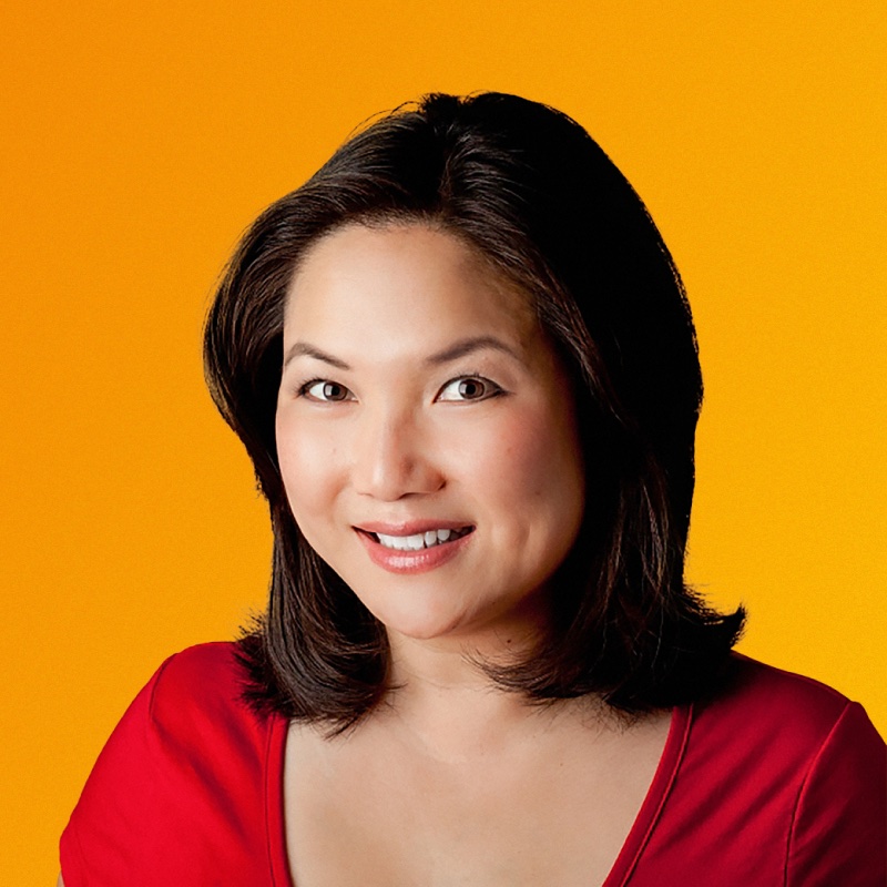 Pam Wu head shot in red shirt