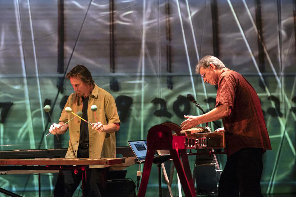 men playing instruments on stage