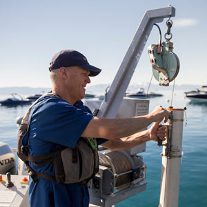 A researcher test samples from Lake Tahoe
