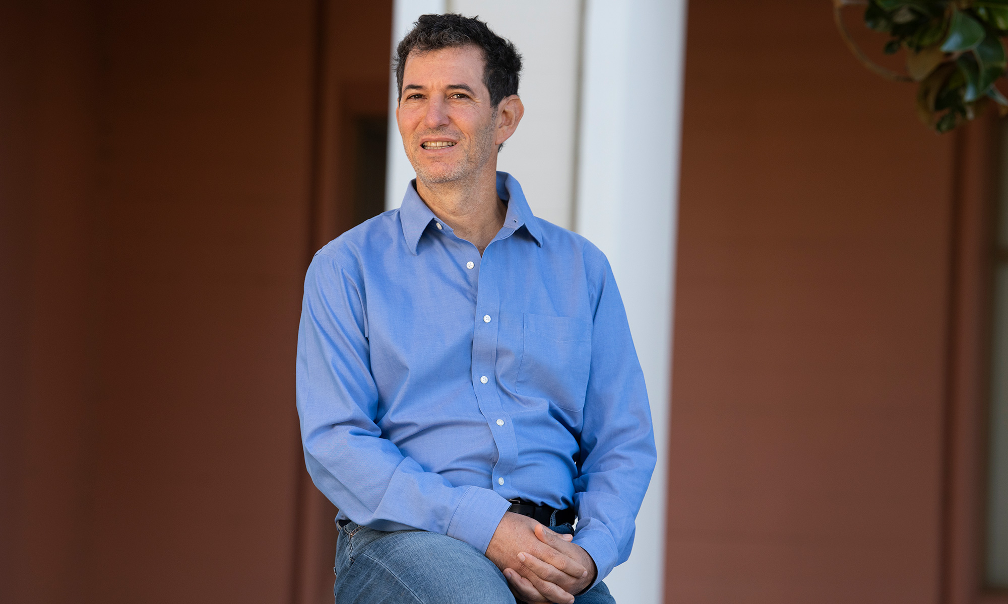 Professor Rick Robbins in a blue shirt photographed on campus