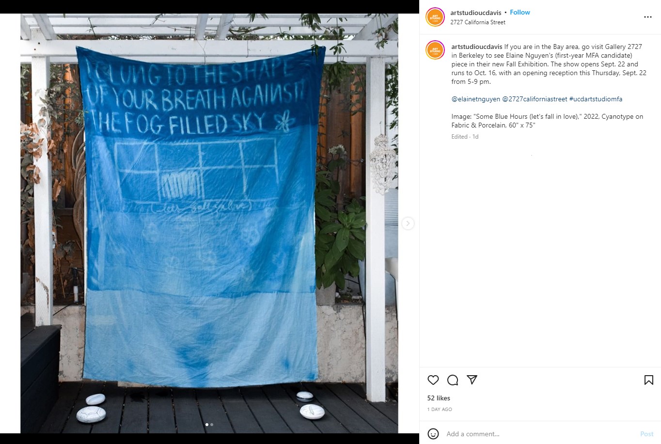 Blue artwork drape with words printed on it from UC Davis Art Studio