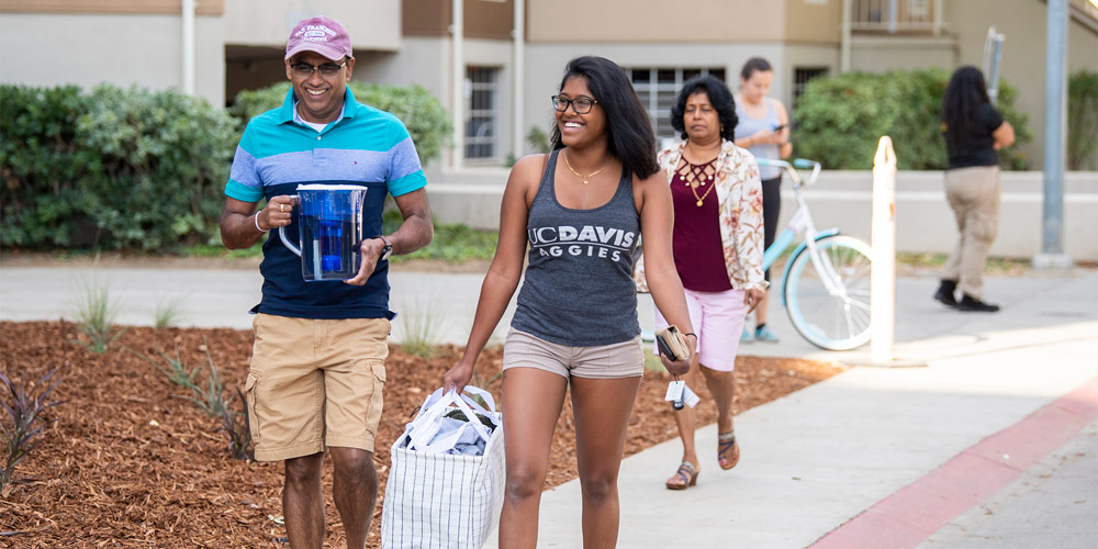 student and parents walking to residence halls
