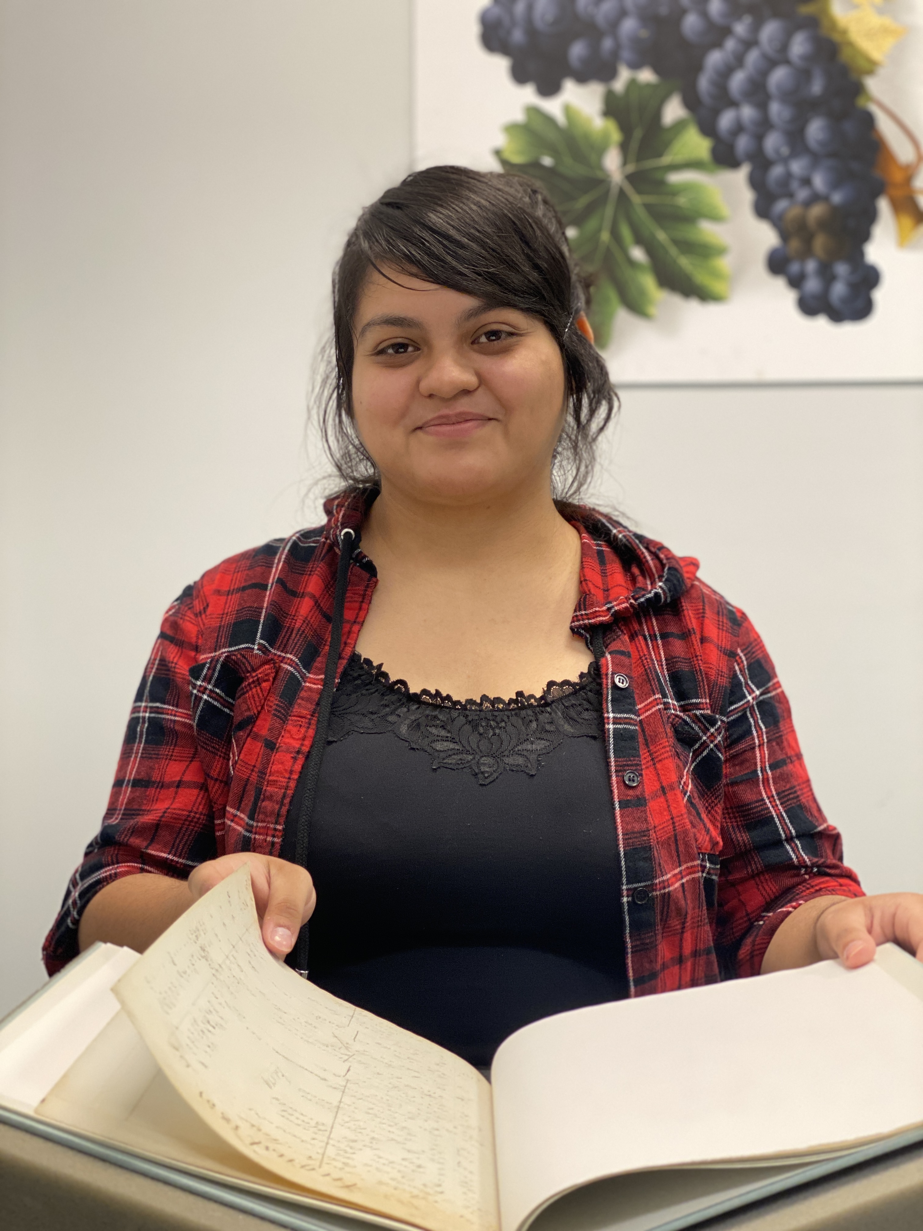 Student looks at an archival book at UC Davis.