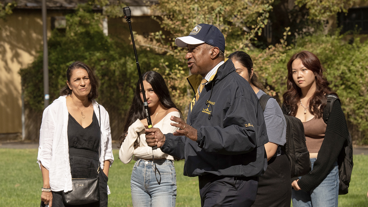 Chancellor Gary S. May among a tour group