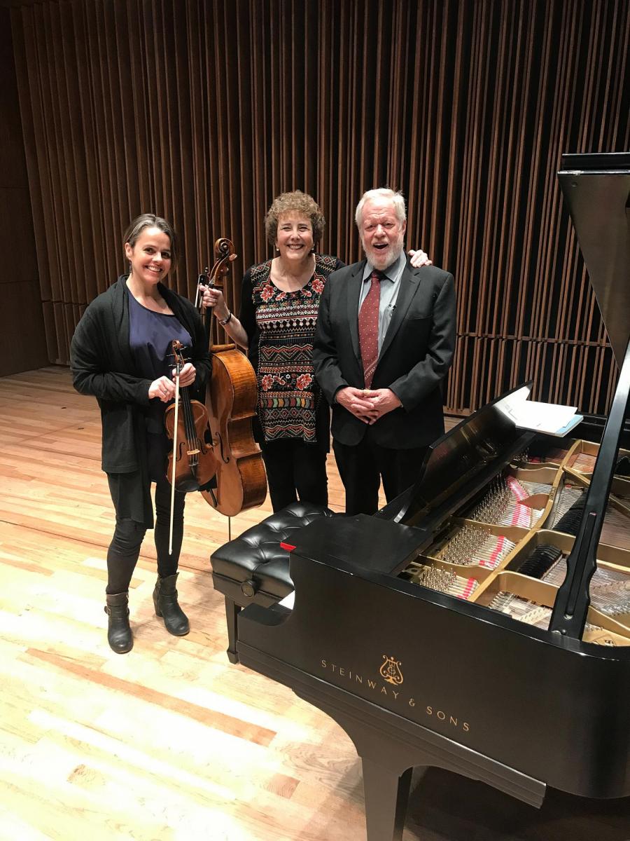 Trio with instruments on stage