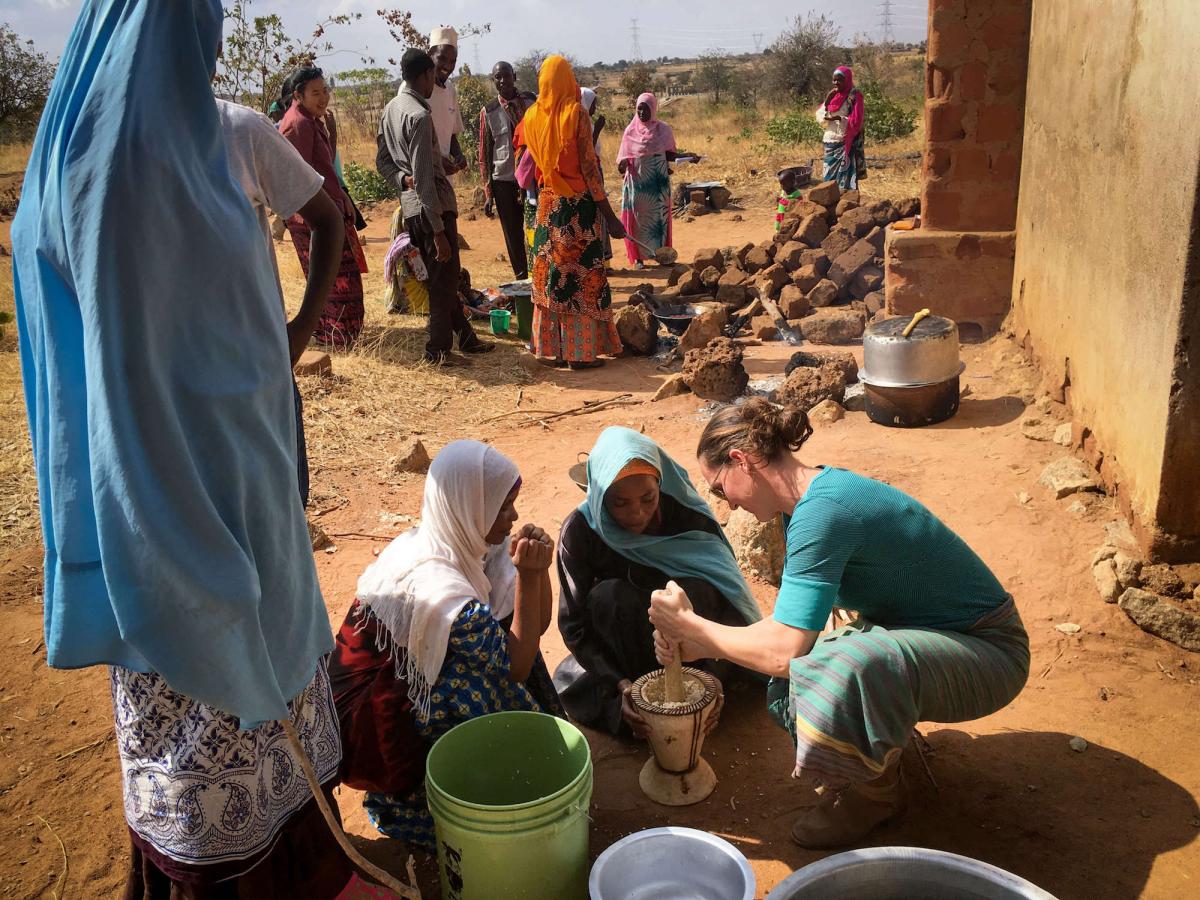 Carrie Waterman helps harvest moringa