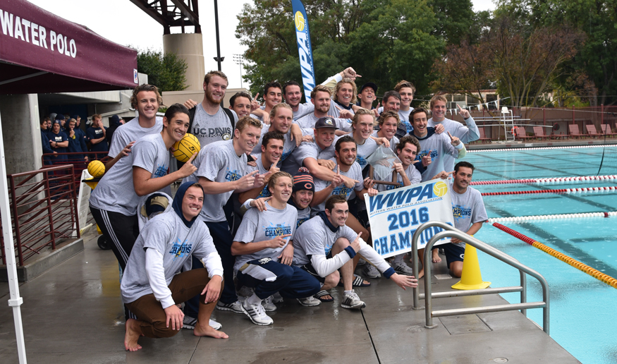 Men's water polo team on pool deck.