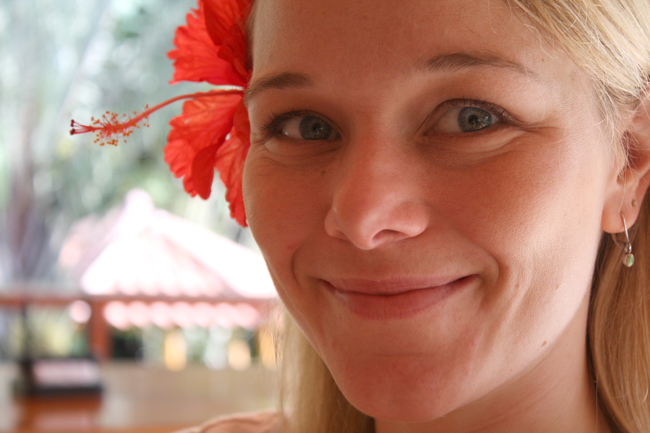 Sharon Gray with flower in hair.