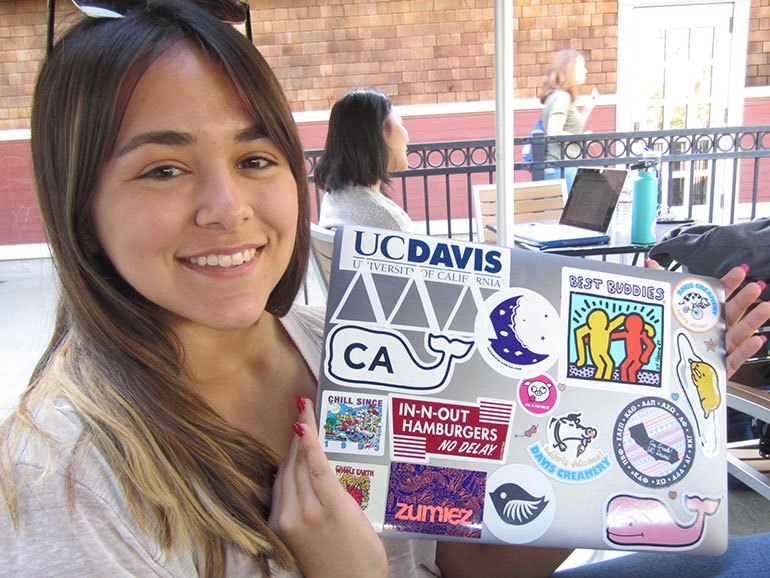 Isabella Sanchez shows off laptop stickets.