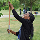 Tene Goodwin prunes a tree in Davis.