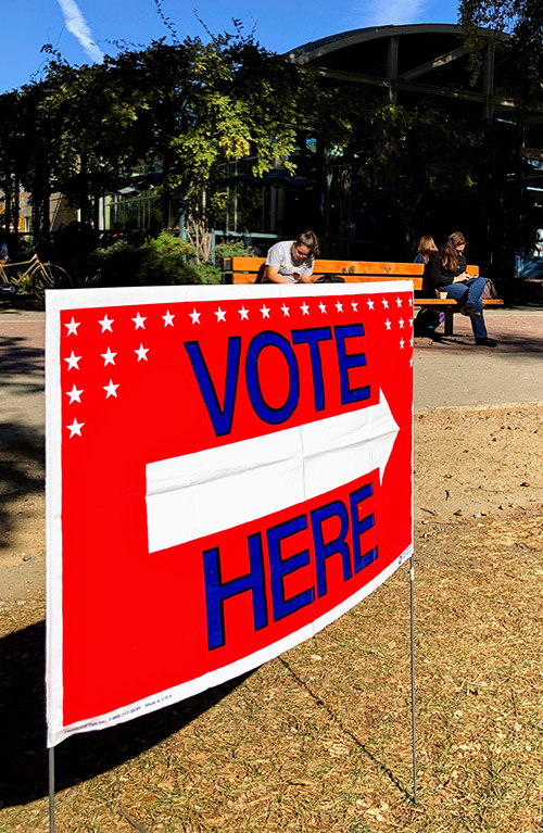 A "vote here" sign outside the Memorial Union.