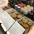 Cookies and beer on a table.