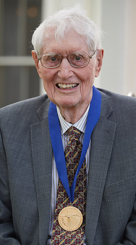 Dick Dorf wearing medal.