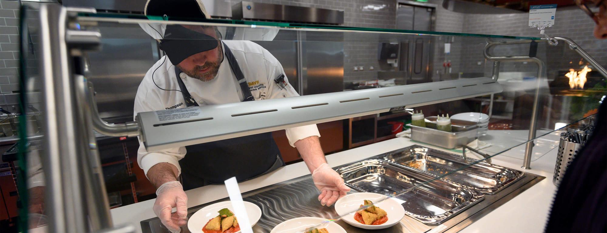 Chef serves samosas
