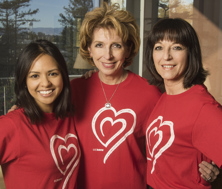 Three women in red heart T-shirts