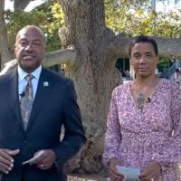 Chancellor May and LeShelle standing in the quad