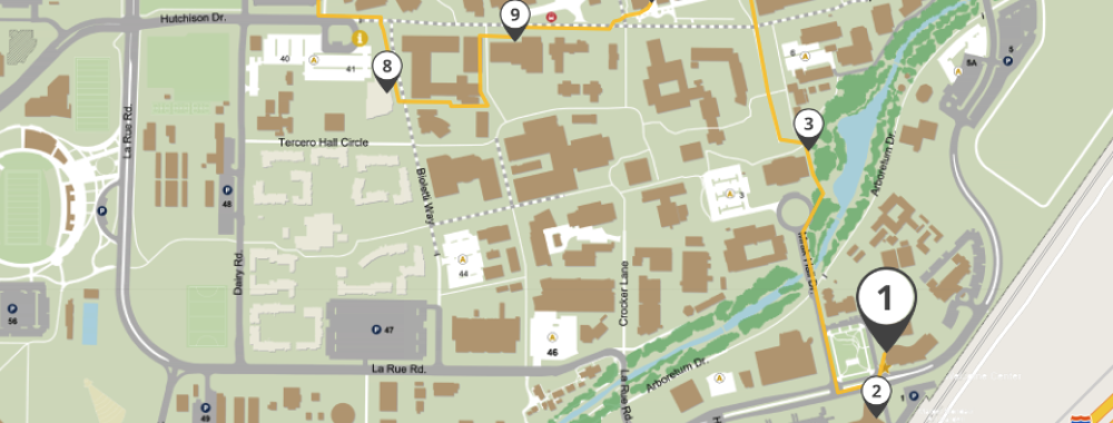 Detailed map graphic of buildings, green spaces, roads, and two numbered markers