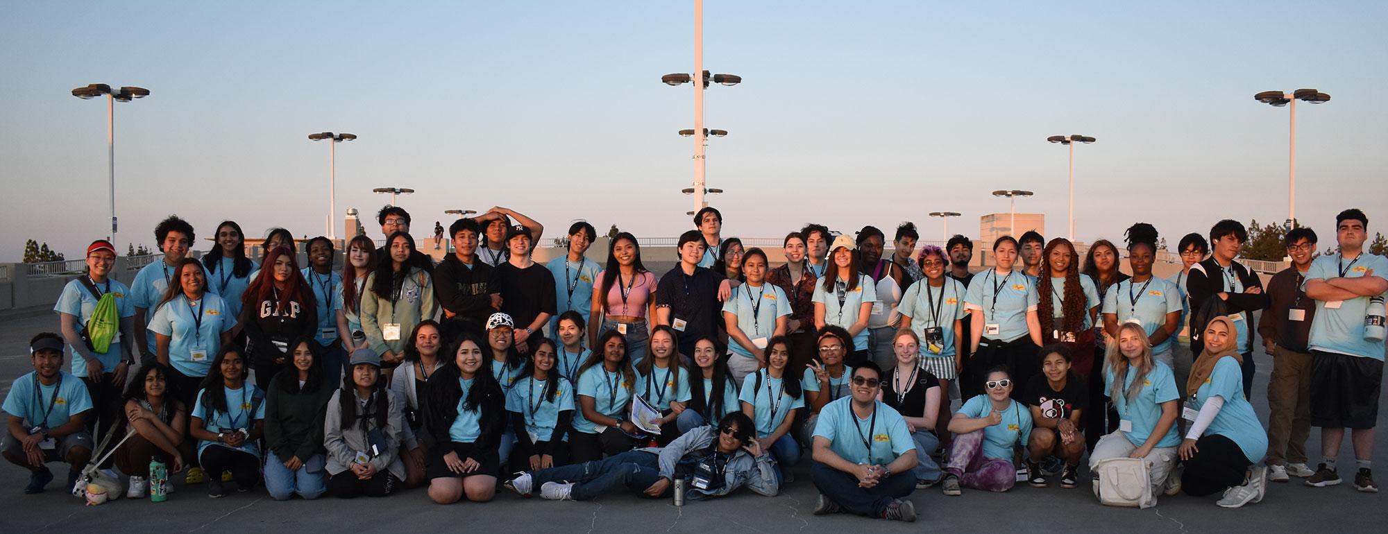 a2b students posing in front of a sunset