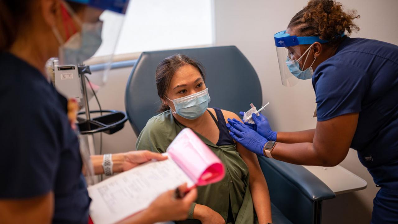 Woman receives vaccination.