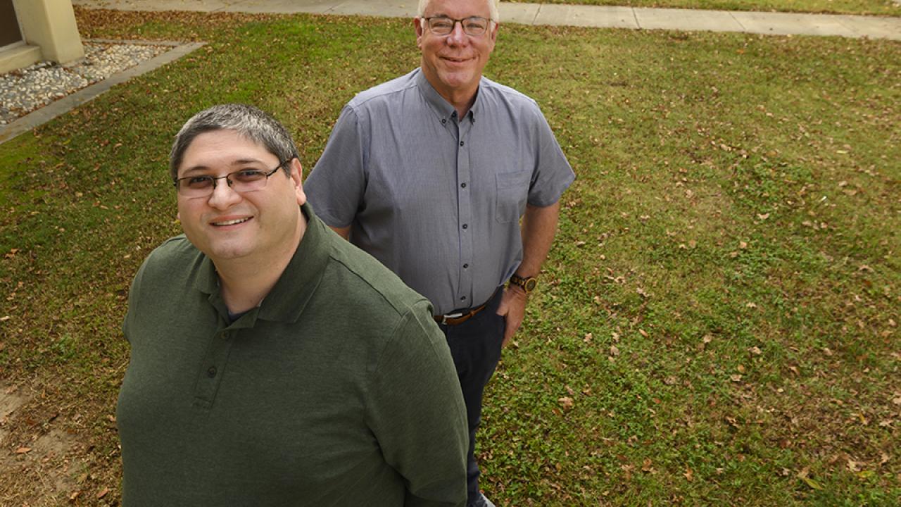 Two scientists outdoors