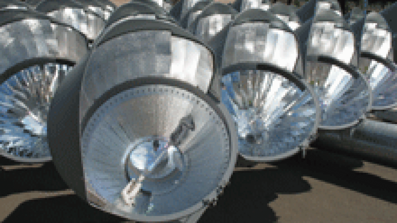 Photo shows part of one of the banks of lights, prior to
being hoisted into place. A Musco Lighting spokesman said the reflectors
within each fixture are customized for that light, ensuring that the beam
goes &ldquo;where we want it go.&rdquo; The re