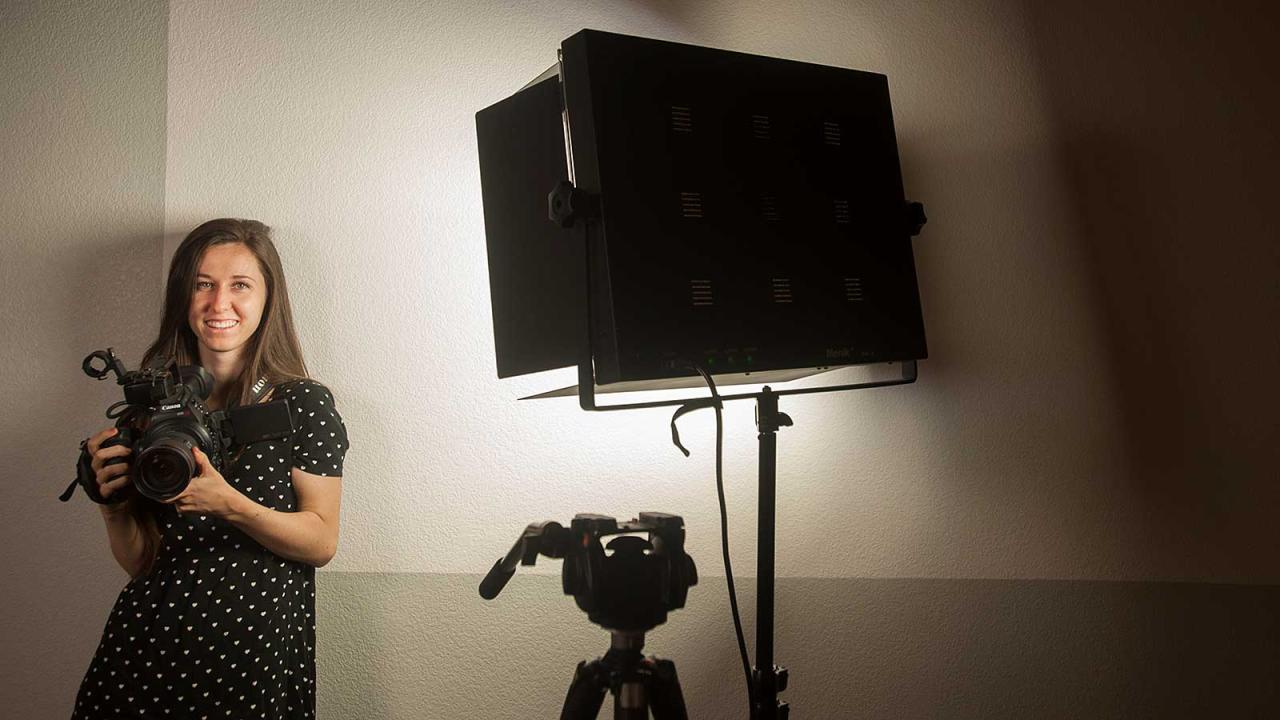 Female student with cinematography equipment