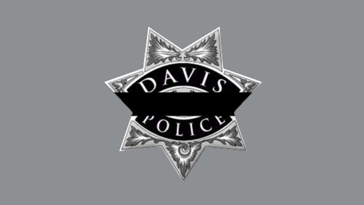 Davis police badge with mourning band