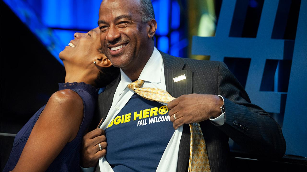 Chancellor Gary S. May displays an Aggie Heroes shirt under his dress shirt..