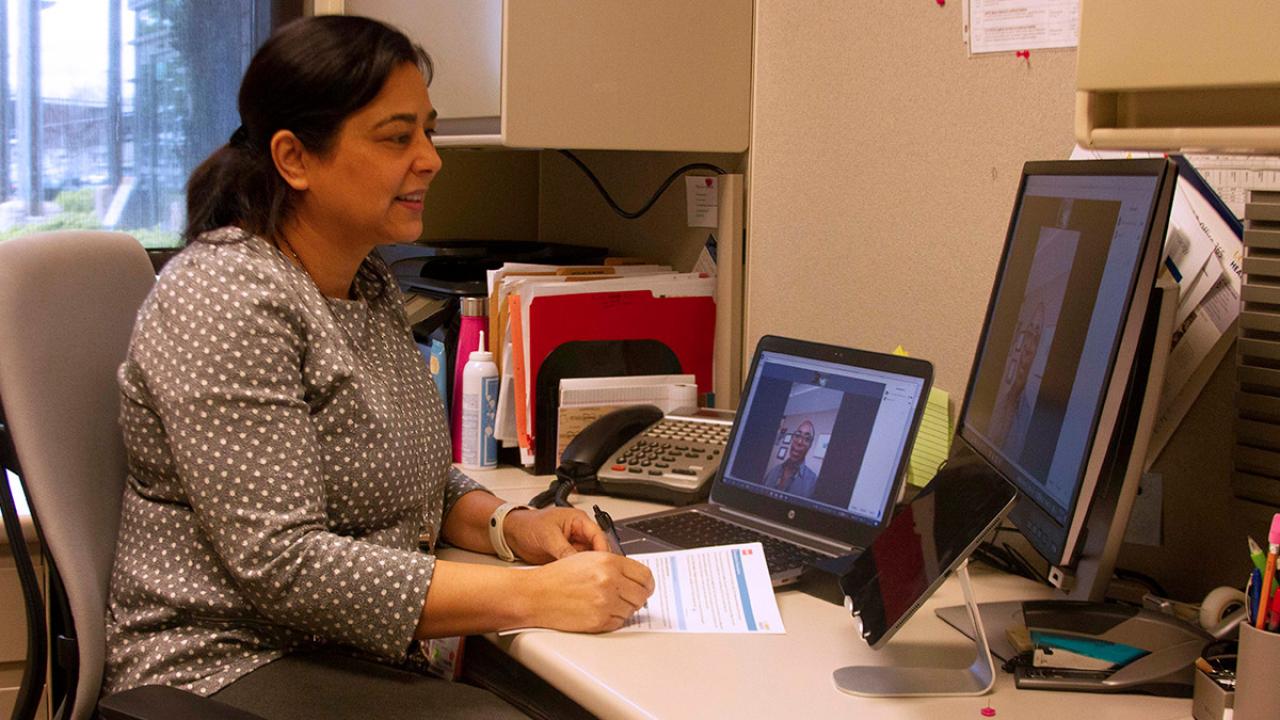 Dorcas Liriano Roa video chats with a woman.