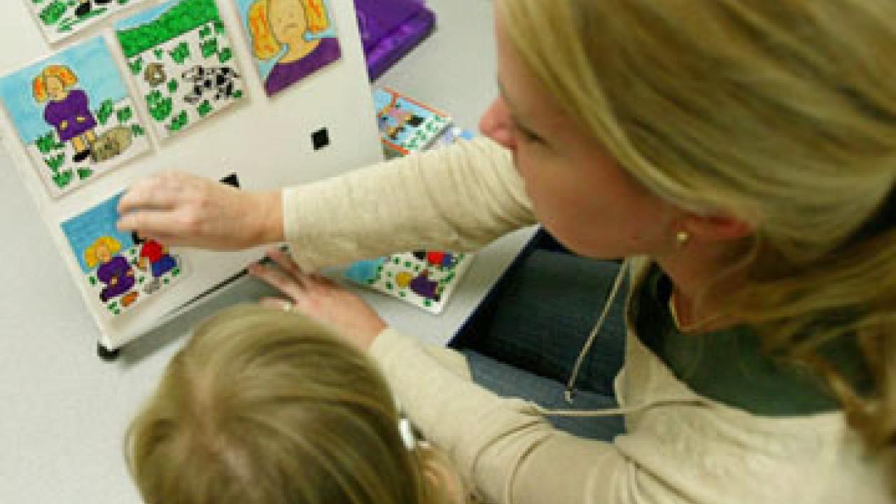 UC Davis psychologist Kristin Laguttuta interviews a 3-year-old for a study on anxiety in males and females.
