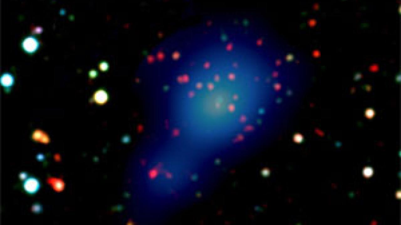 Photo: stars in dark sky, showing light-bulb shaped image in center