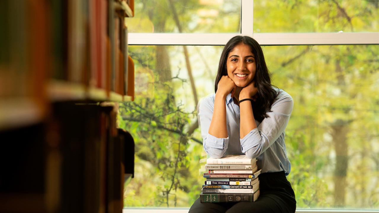 female student sitting in library