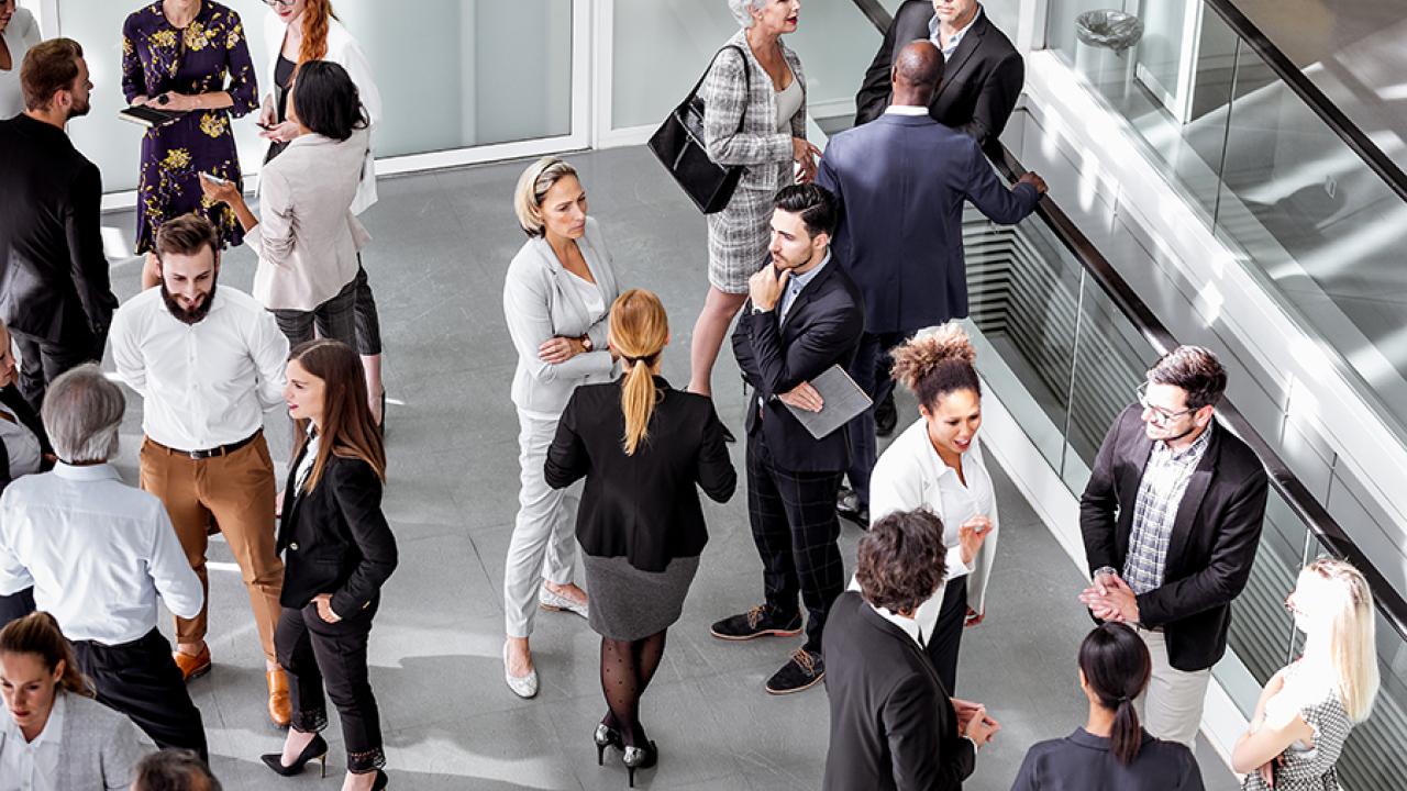 Stock photo of people standing around. 