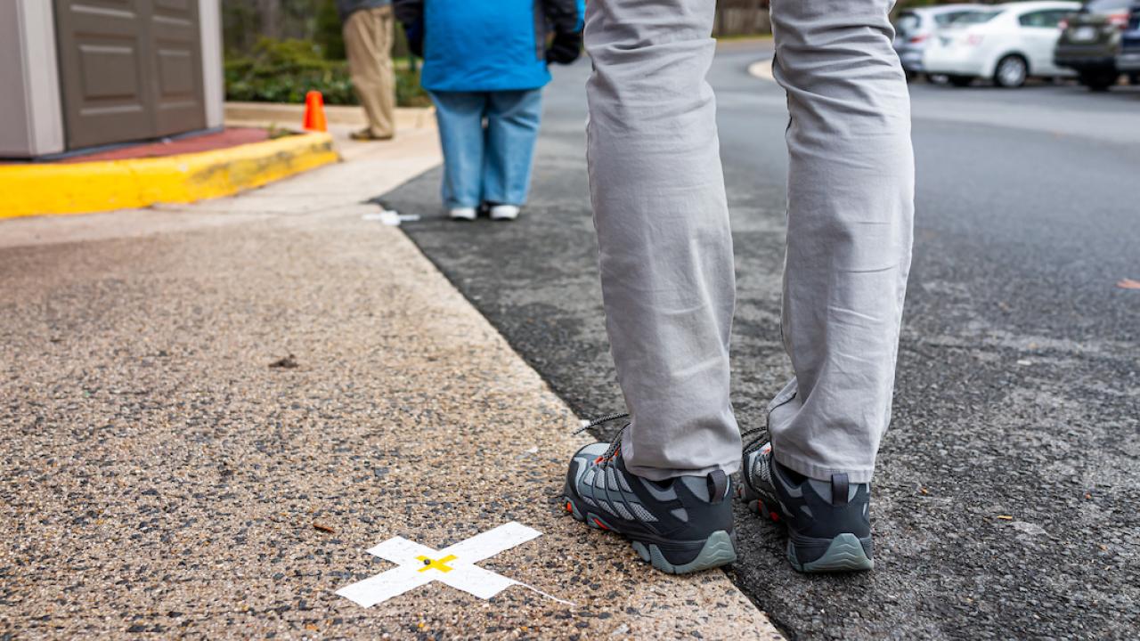 people stand apart in line, social distancing
