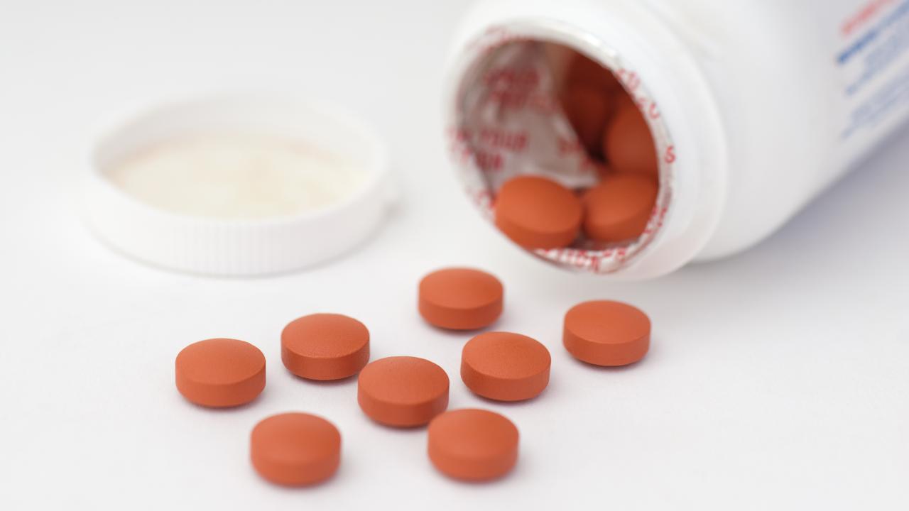 Pills spilling from a bottle