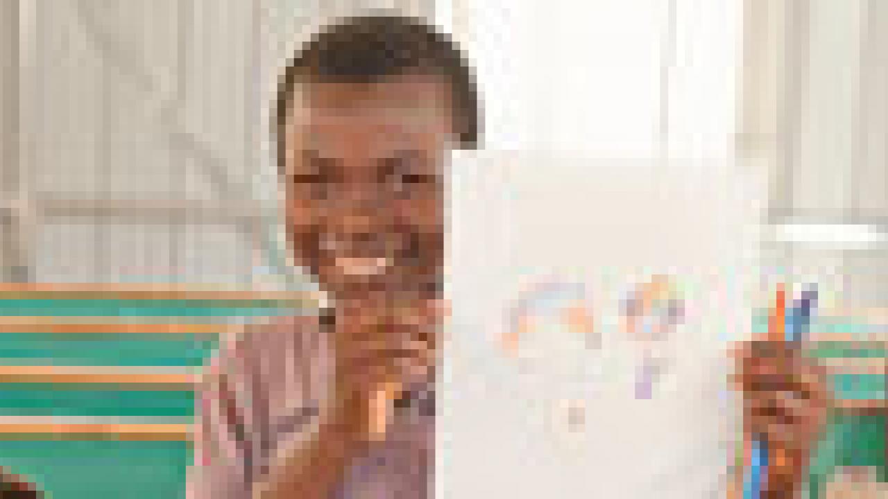 Boy holding picture