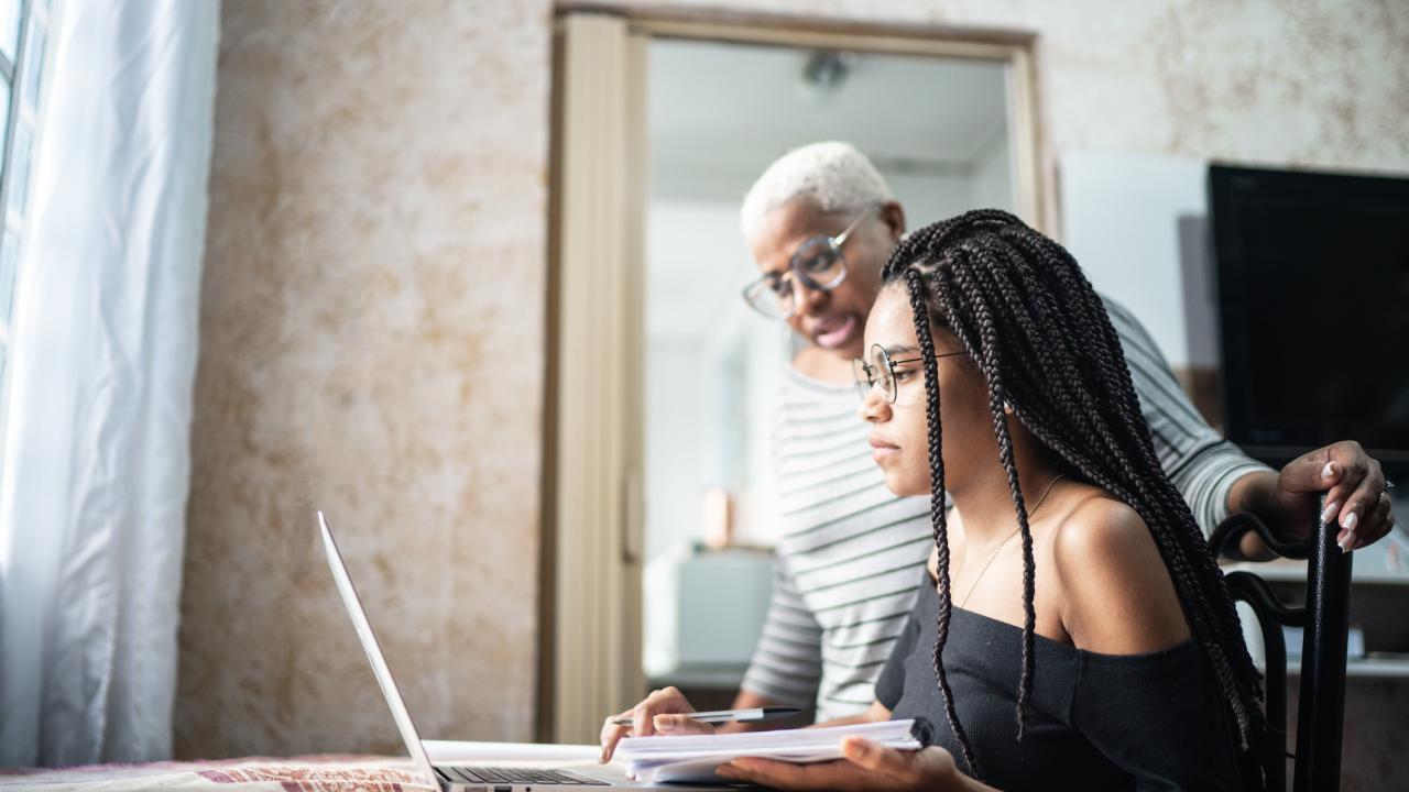 Student working with adult