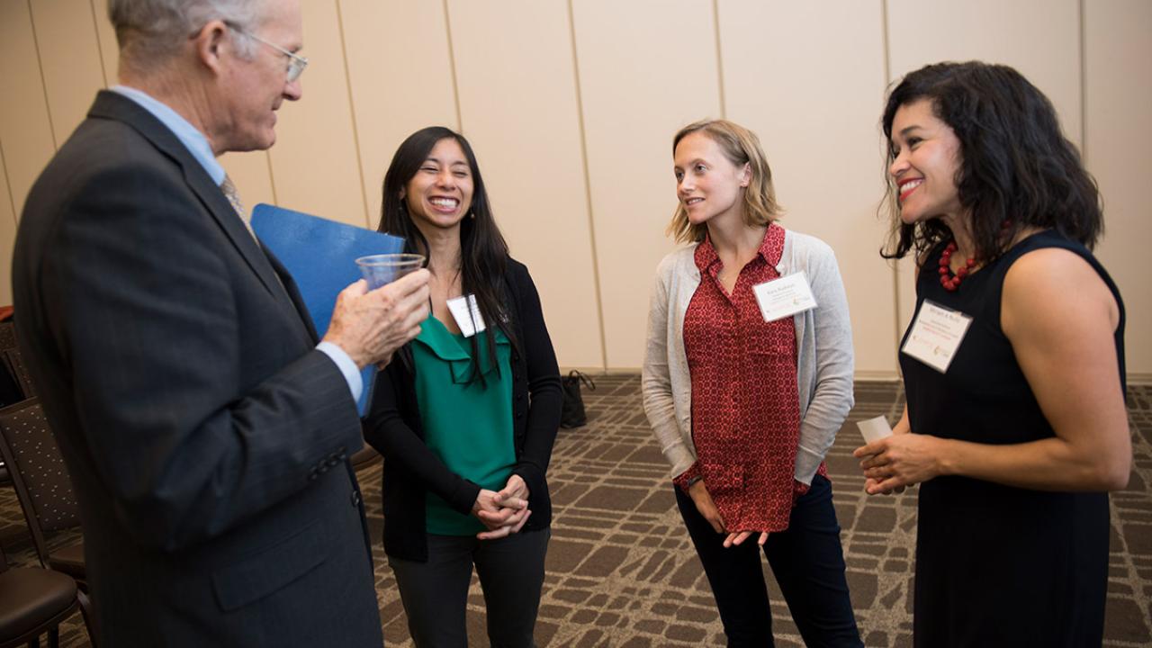 Ken Burtis talks with Marie Cuevas Heffern, Kara Rudolph and Miriam A. Nu&ntilde;o.