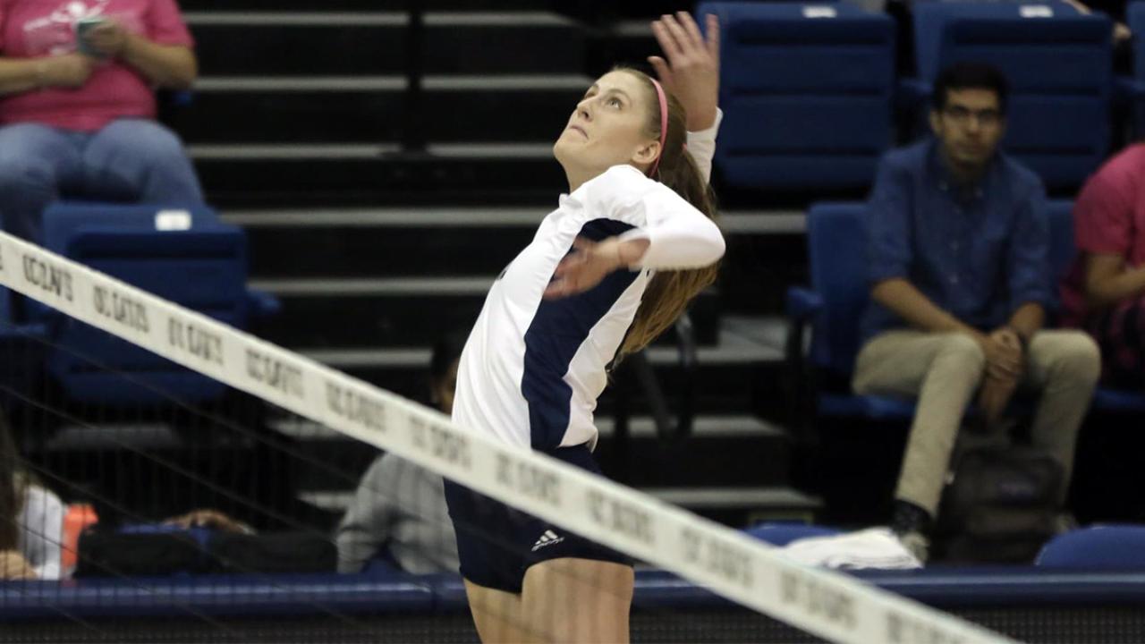 Volleyball player Lauren Matias jumps for the ball.