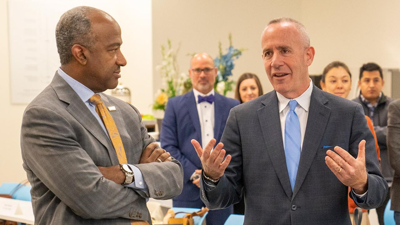 Chancellor Gary S. May listens as Darrell Steinberg speaks.