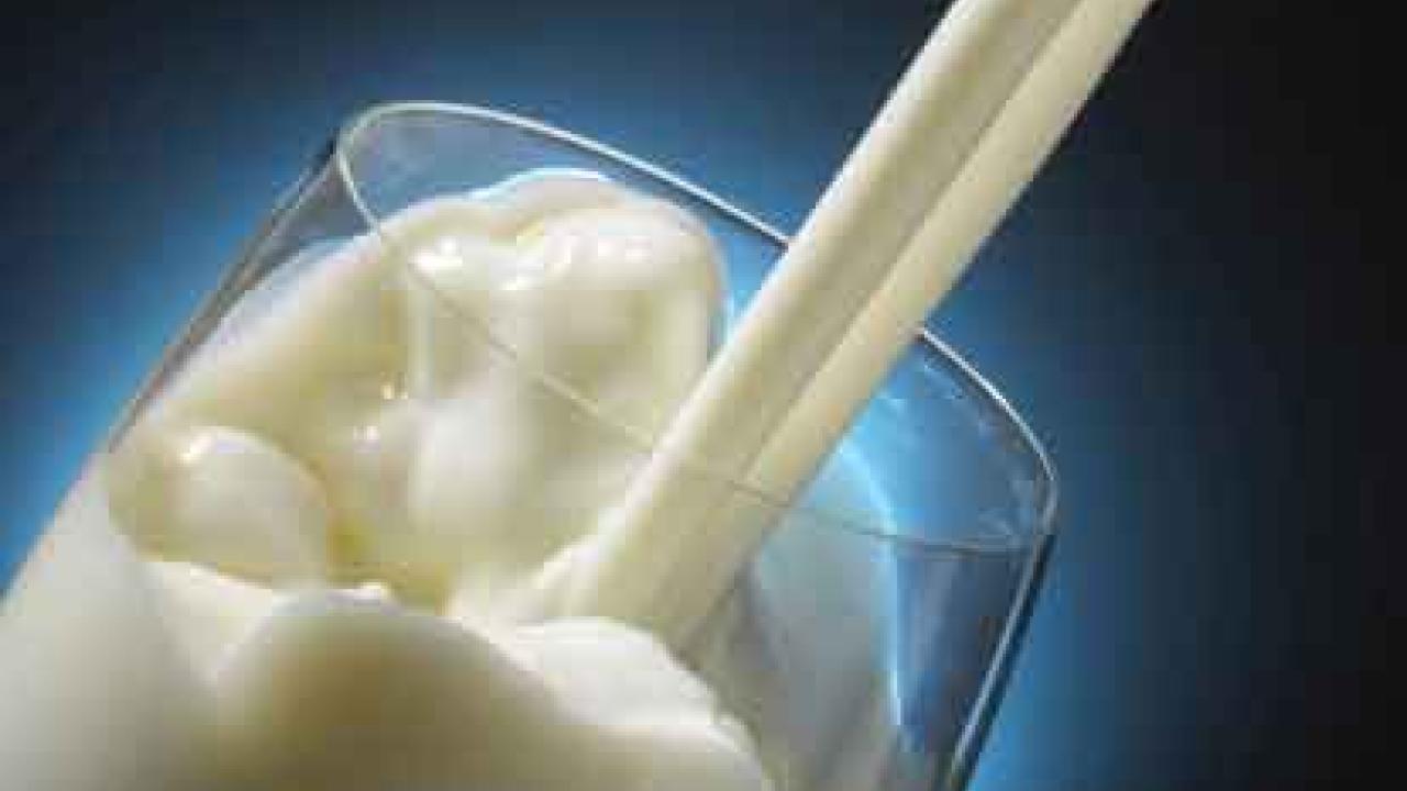 Photo: Milk pouring into glass