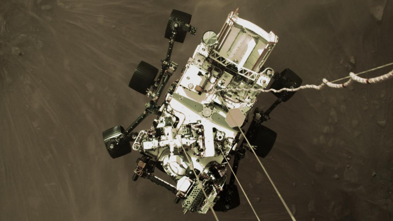 Perseverance rover is lowered to surface of Mars, in image that shows rigging from "sky crane."