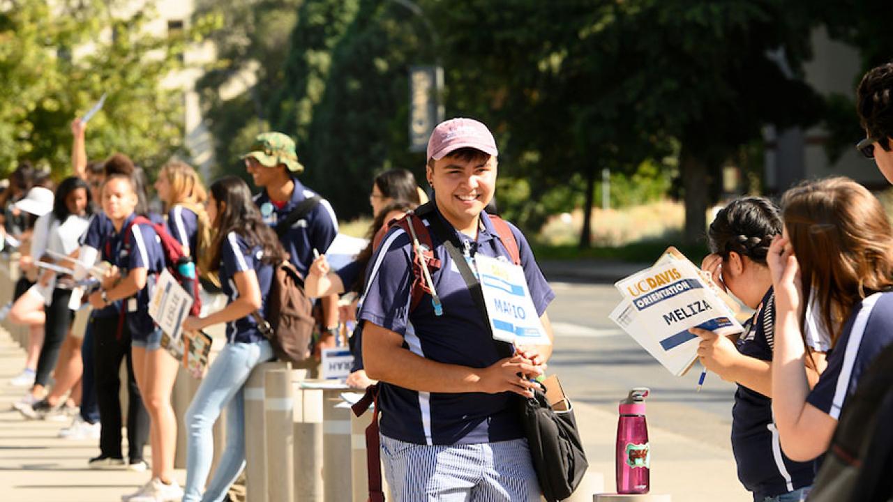 A line of orientation leaders outside the Mondavi Center