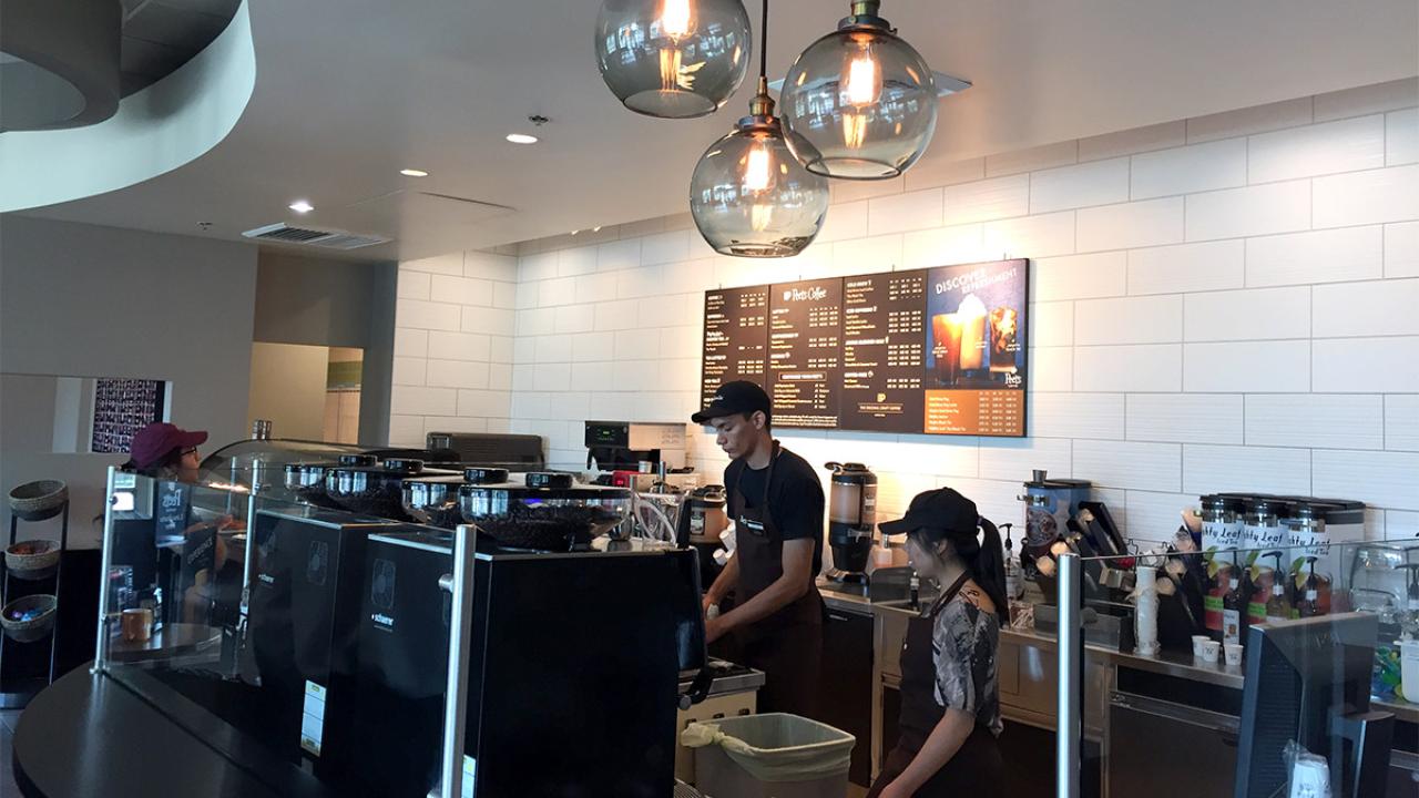 Employees prepare a drink at the ARC Peet's.